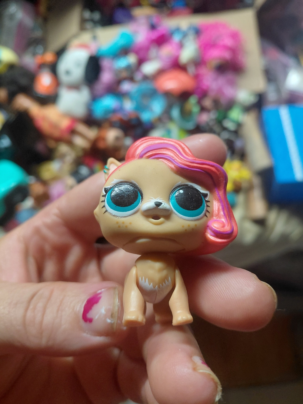 an L.O.L. Surprise! collectible pet figure, resembling a character lol surprise
